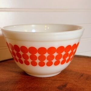 This is a vintage Pyrex Mixing Bowl in the "New Dot" pattern.